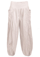 white loose fit 100% cotton pants with wide flat front waistband and pockets