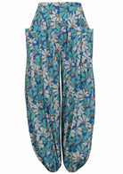 Royal blue based floral print cotton harem pants with buttoned ankles with pockets.