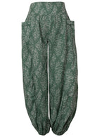 Sage green based floral print cotton harem pants with buttoned ankles with pockets.