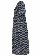 Side view of navy blue floral motif printed cotton midi length button through dress  with hidden side pockets.
