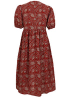Back view of red based floral print cotton midi length button through dress with voluminous sleeves with elastic in the cuff