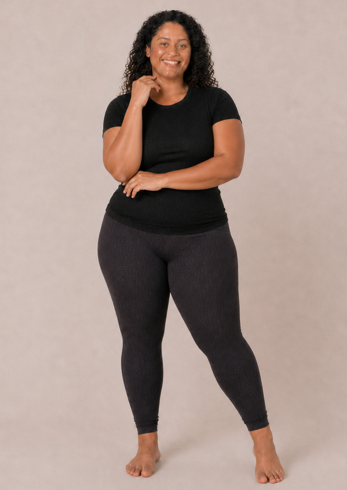 Plus size model wearing grey leggings