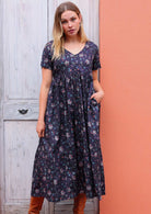 Loose fit cotton dress with short sleeves and V-neck has pockets