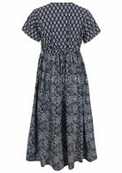 Back view of navy blue based floral print V-neck cotton dress with pockets.