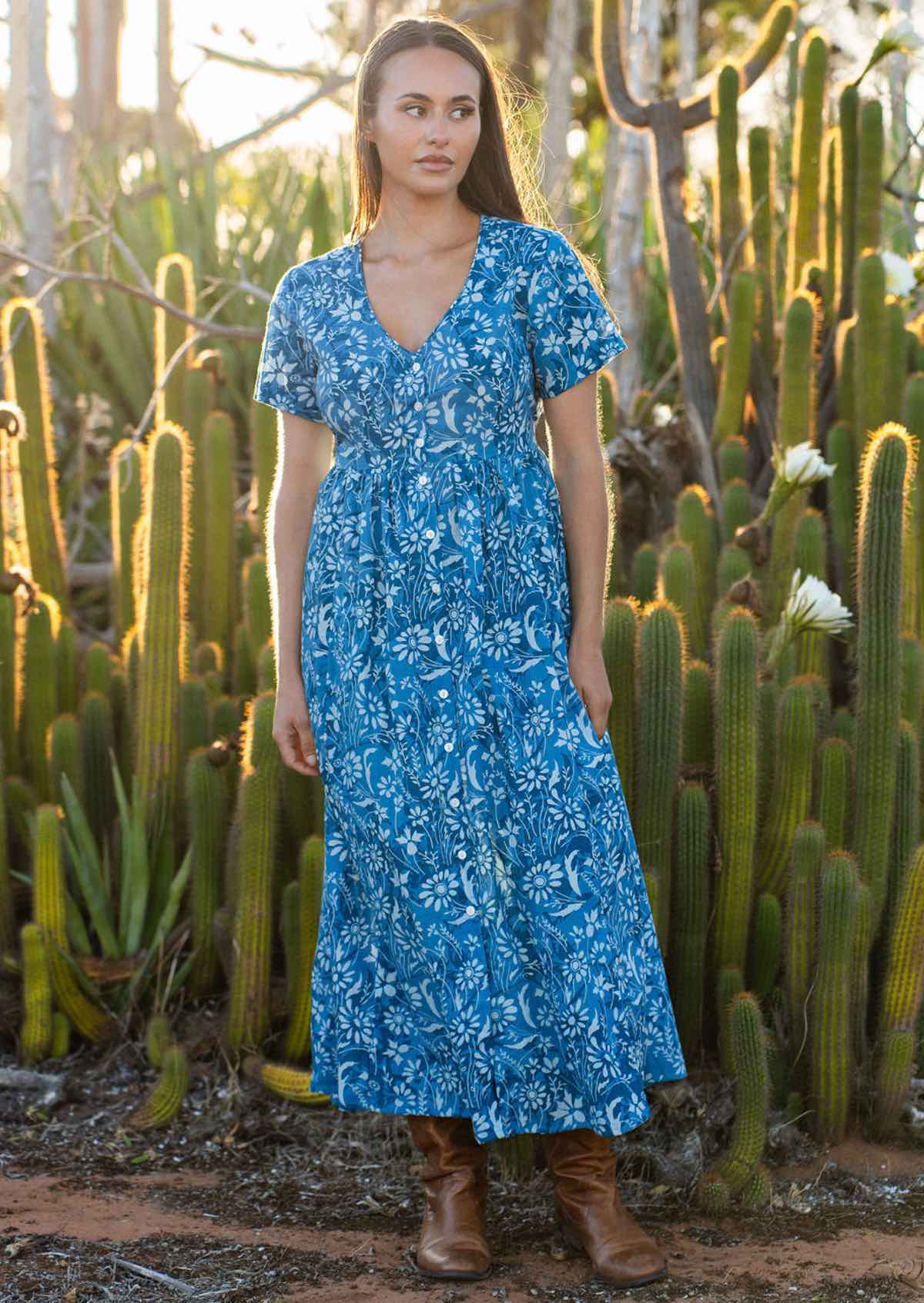 woman in blue cotton floral v neck maxi dress 