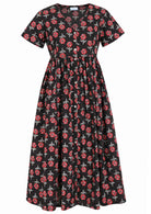 Front view of black based floral print V-neck cotton dress.