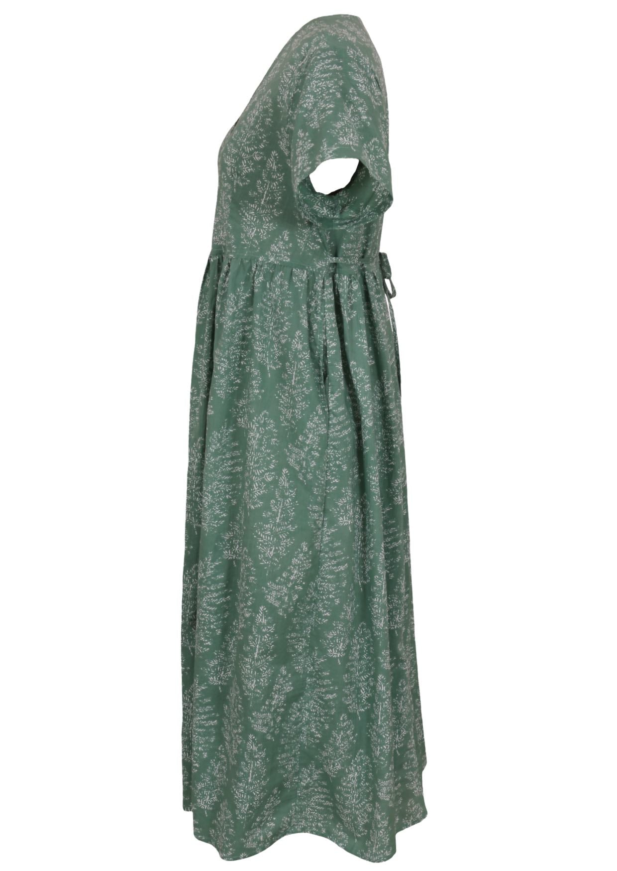 Side view of green based floral print V-neck cotton dress with pockets.