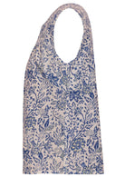 Cap sleeves cotton top with white based blue floral print on a white background.
