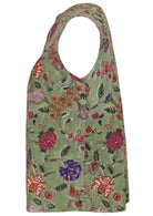 Side view of cap sleeves cotton top with moss green based floral print on a white background.