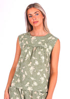 Model wears sweet floral on a pale green base cotton sleeveless top with gathers across the bust