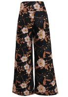 Back view of women's 100% cotton wide leg pant in black based floral print with side zip