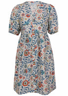 V-neck cotton dress with white based floral print.