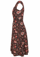 Knee length retro floral cotton dress with cap sleeves, pockets and piped details at the waistband