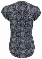 Back view of navy blue based floral print 100% cotton top on a white background.