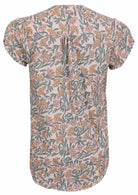 Back view of white based floral print 100% cotton top on a white background.