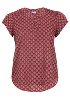 Front mannequin photo of cap sleeved cotton top with ruched detail on front of shoulders