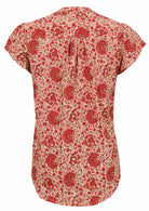 Back view of cream based warm floral print 100% cotton top on a white background.