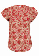 Cream based warm floral print cotton top with V-neckline on a white background.