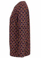 Side image of dark purple floral print shirt style top with long sleeves.