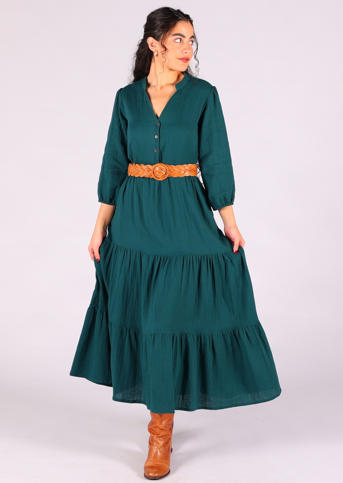 Model wears gorgeous double cotton boho tiered maxi dress with belt cinching the waist