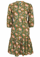 Cotton tiered midi dress in the Keisha print, of green, orange and yellow florals on a lighter green base