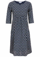 Relaxed fit below knee length cotton dress with 3/4 sleeves, pockets and round neckline.