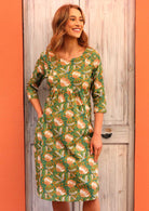 Lined cotton dress with round neckline with cutout in the centre, empire waistline and pockets