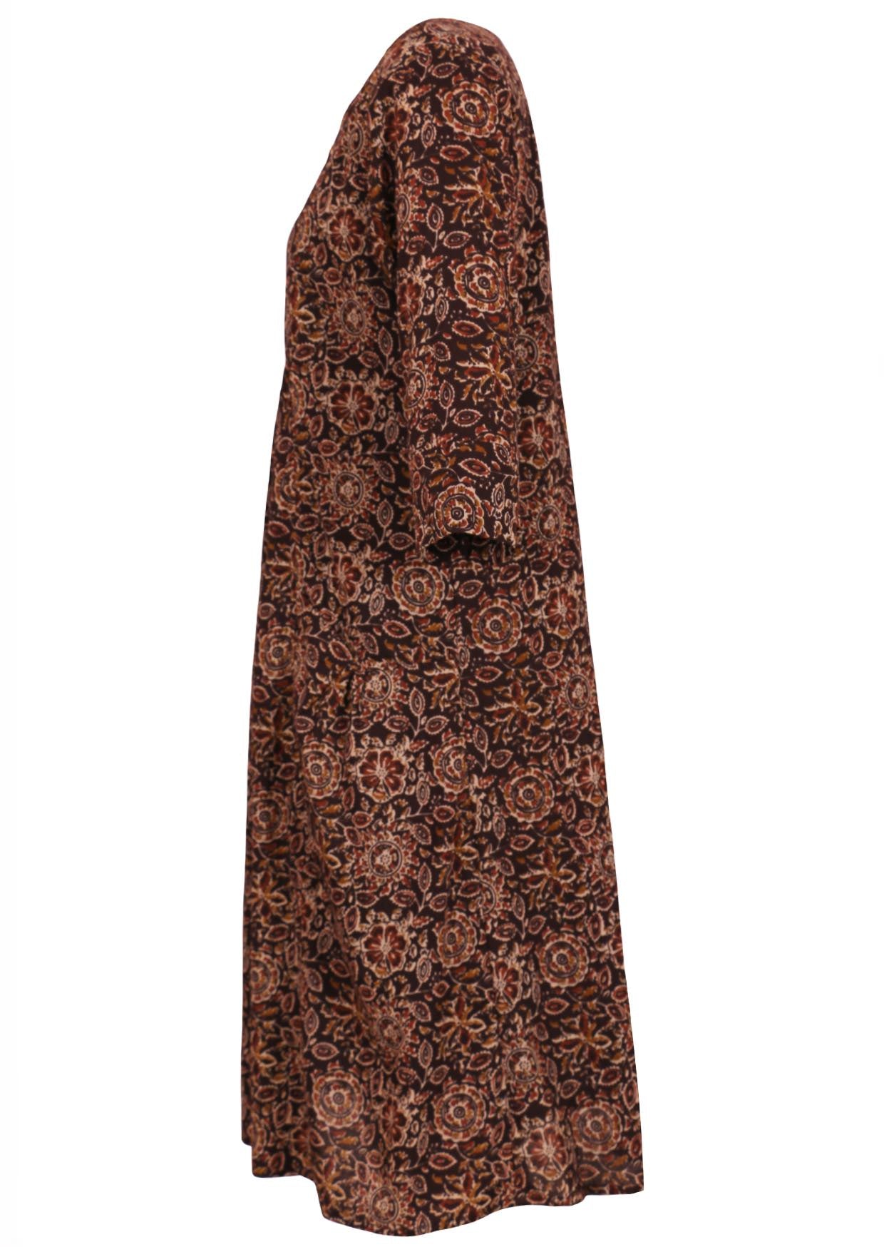 Side view of relaxed fit cotton dress with 3/4 sleeves, pockets and length below the knee.