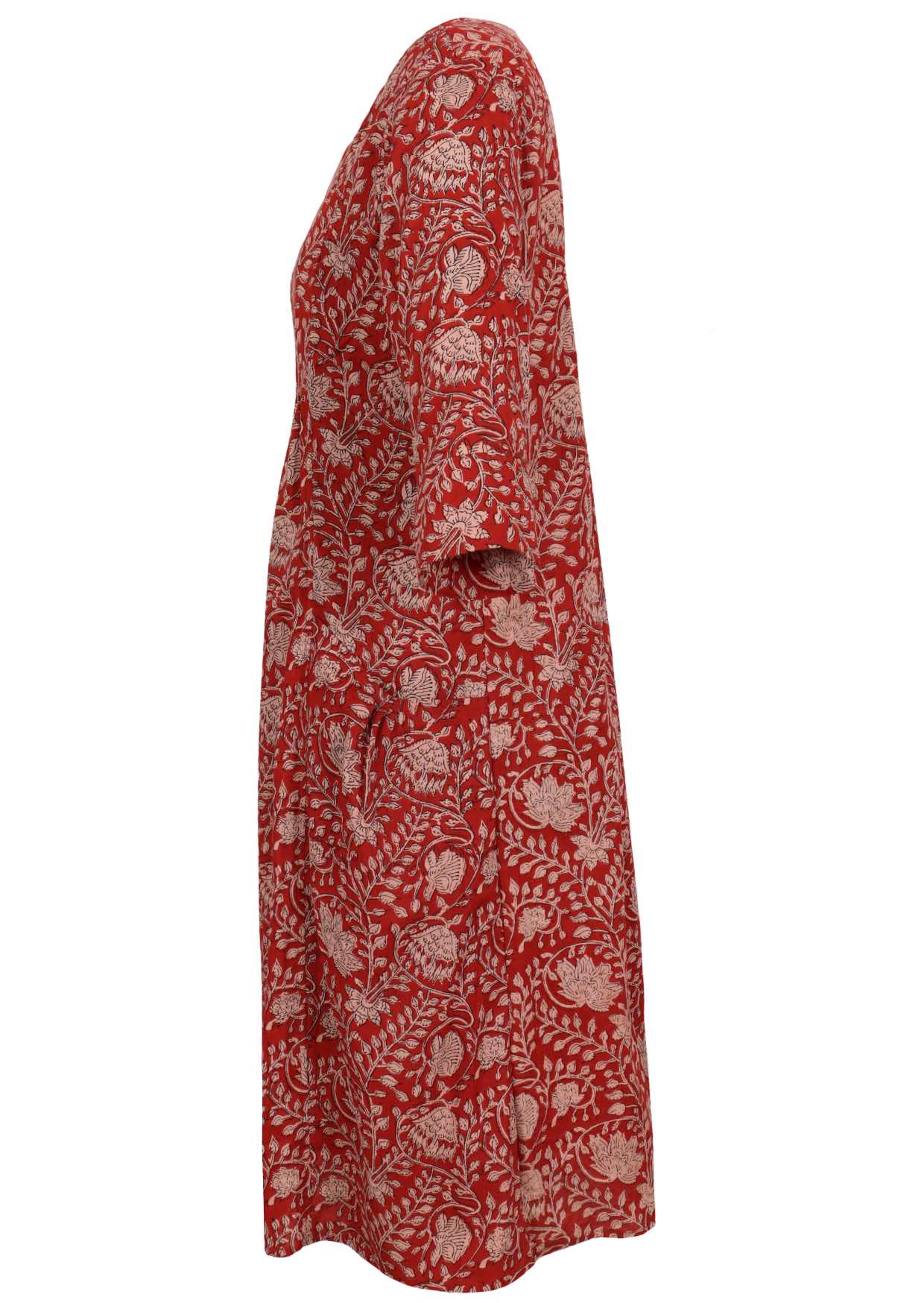 Side view of relaxed fit below knee length cotton dress with 3/4 sleeves, pockets and round neckline.