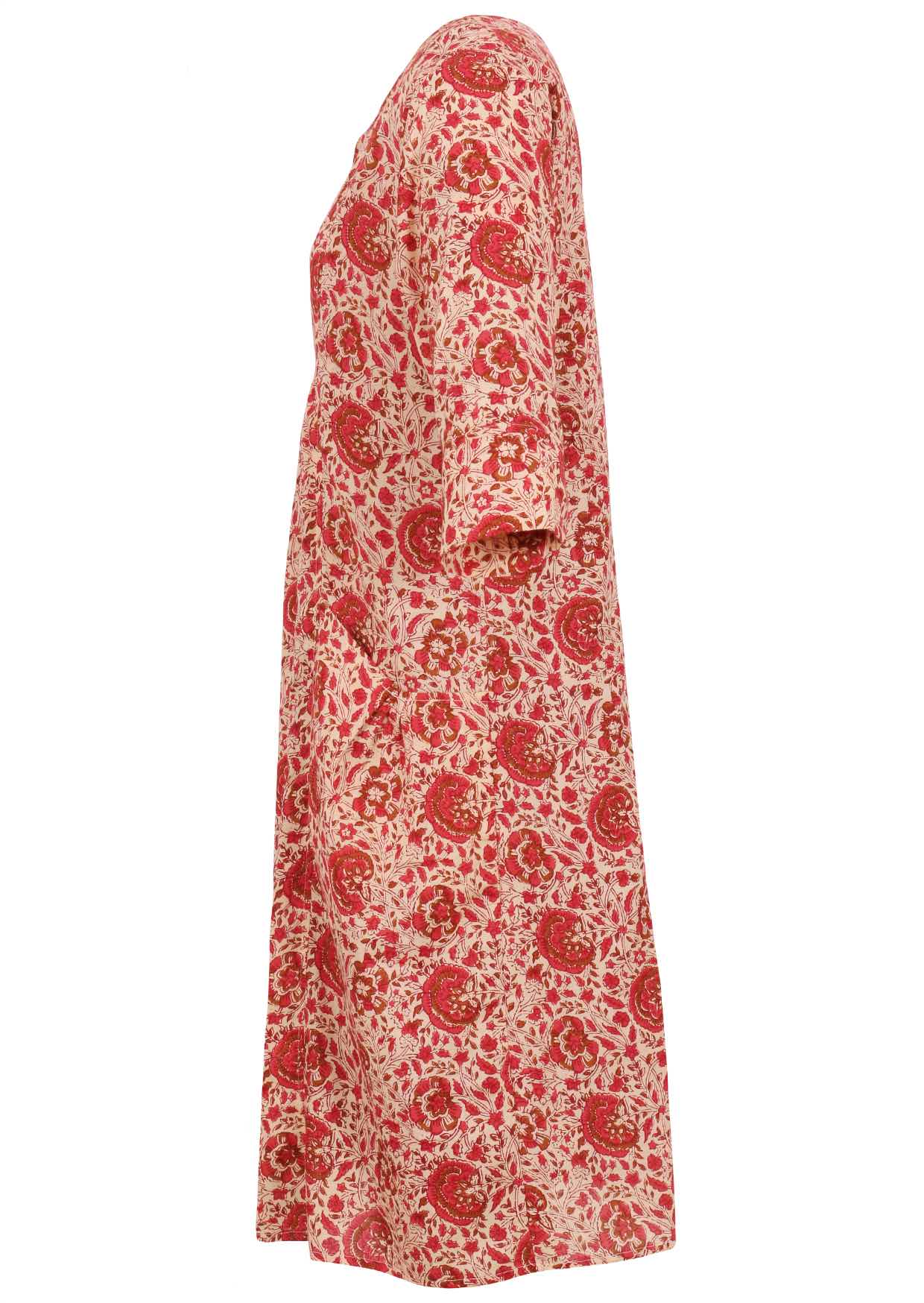 Side view of relaxed fit below knee length cotton dress with 3/4 sleeves, pockets and round neckline.