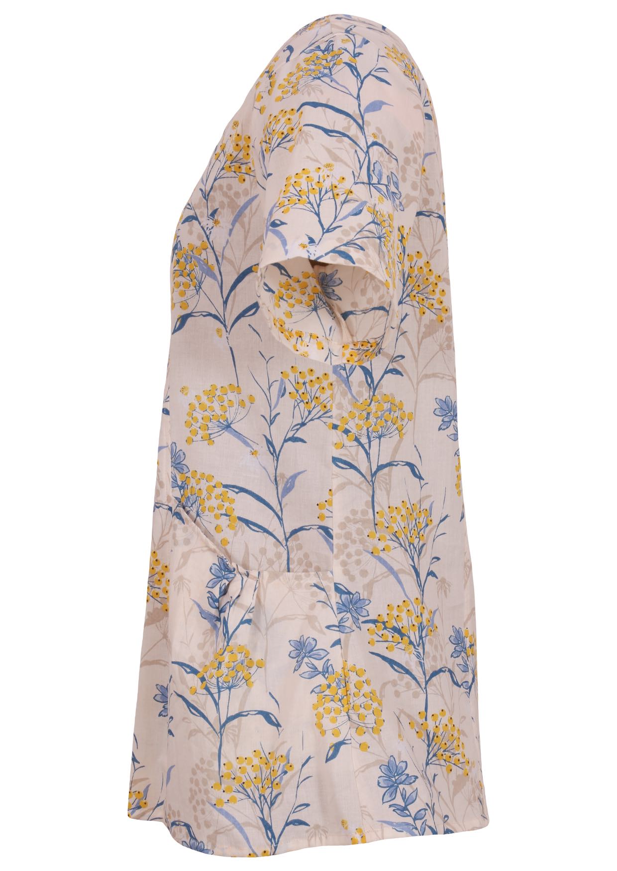 Side view of loose fit cotton blouse with pockets, short sleeves and round neckline in floral print on neutral background