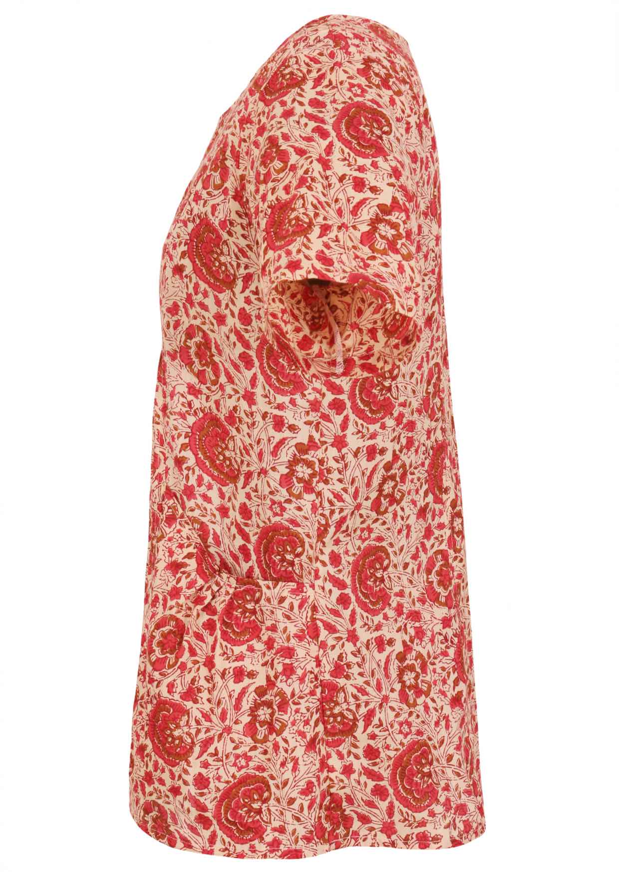 Side view of loose fit cotton blouse with pockets, short sleeves and round neckline in floral print on cream background