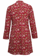 Back mannequin photo of cotton long sleeve tunic in floral print on a bright red base