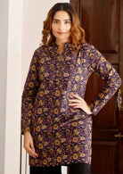 Women stands in A line cotton tunic with full sleeves and V neck with mandarin collar.