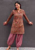 woman wearing 100% cotton Indian Print Tunic over harem pants in warm Indian prints