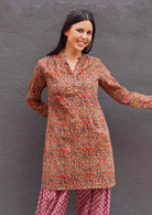 woman wearing 100% cotton Indian Floral Print Tunic in earthy tones over harem pants