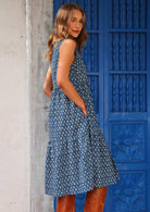 Blue based print lightweight cotton sleeveless dress with hidden side pockets looks great belted