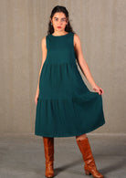 Double cotton tiered dress has some volume in the skirt that sits over the knee