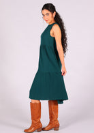 Gorgeous deep teal sleeveless dress with high neckline and hidden side pockets