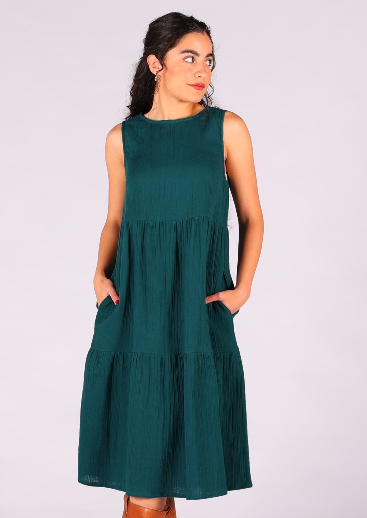 Double cotton sleeveless tiered dress that sits over the knee has hidden side pocekts