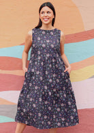 Model wearing Indian Cotton floral print dress with hands in pockets