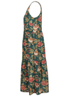 Side mannequin photo of cotton sleeveless three tiered dress in floral print on a bottle green base with hidden side pockets