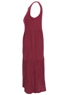 Side mannequin photo of cotton sleeveless three tiered midi length dress with hidden side pockets