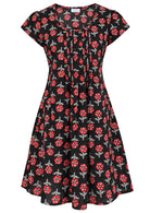 Front mannequin photo of cotton above knee dress in black based floral print.