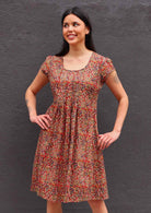 Woman with dark hair  Indian print cotton sundress