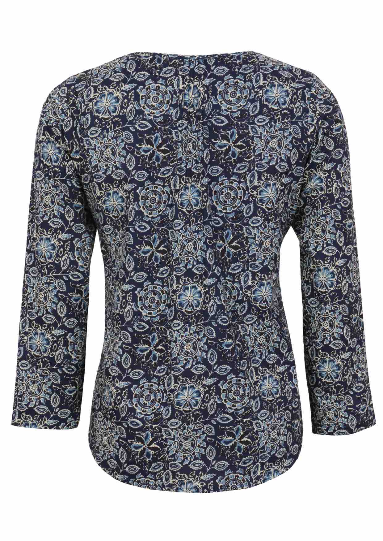 Back image of long sleeve cotton top with navy blue based floral print.