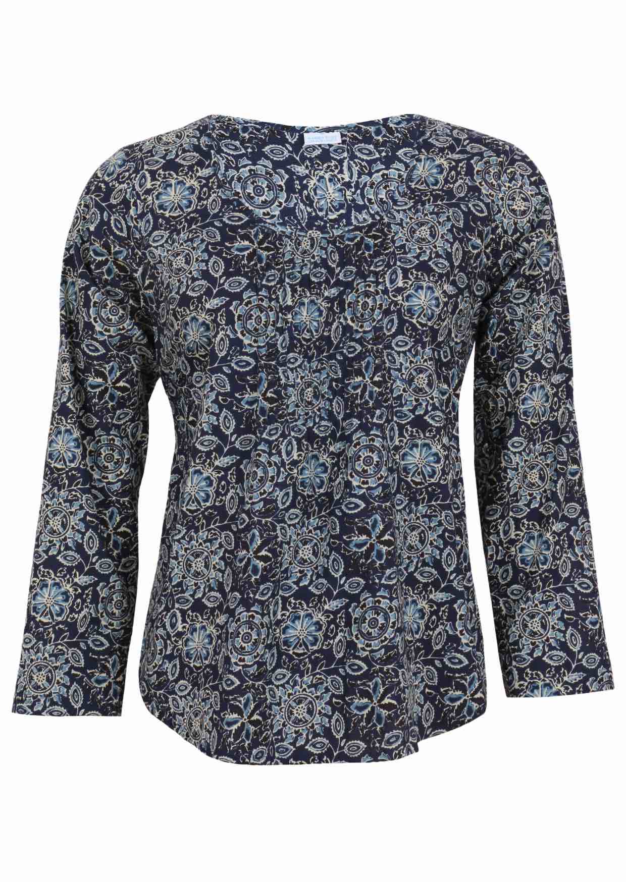 Lightweight 100% cotton top showcasing a simple round neckline, long sleeves and pleats across the bodice.