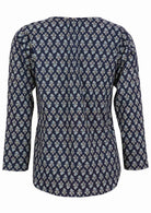 Back image of long sleeve cotton top with navy blue based floral print.