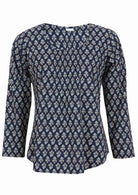 Lightweight 100% cotton top showcasing a simple round neckline, long sleeves and pleats across the bodice.