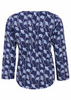 Back image of long sleeve cotton top with navy blue based floral print.
